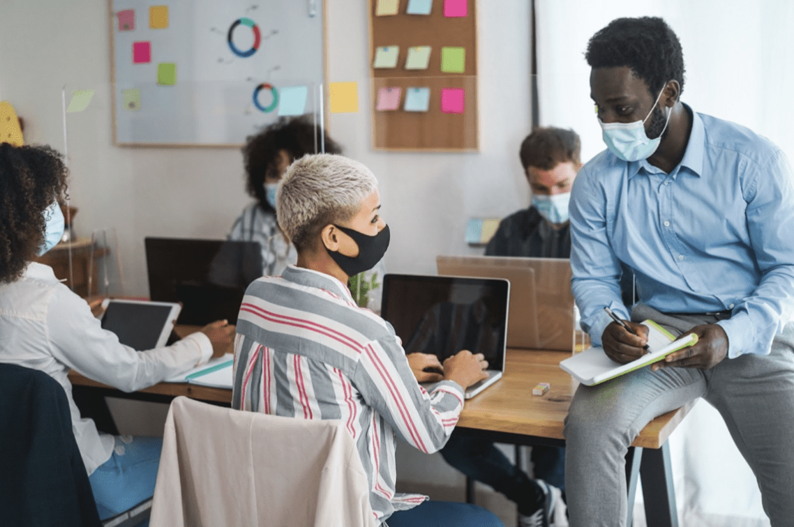 Male teacher with students